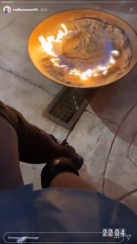 Malika Ménard devant le brasero de l'after
